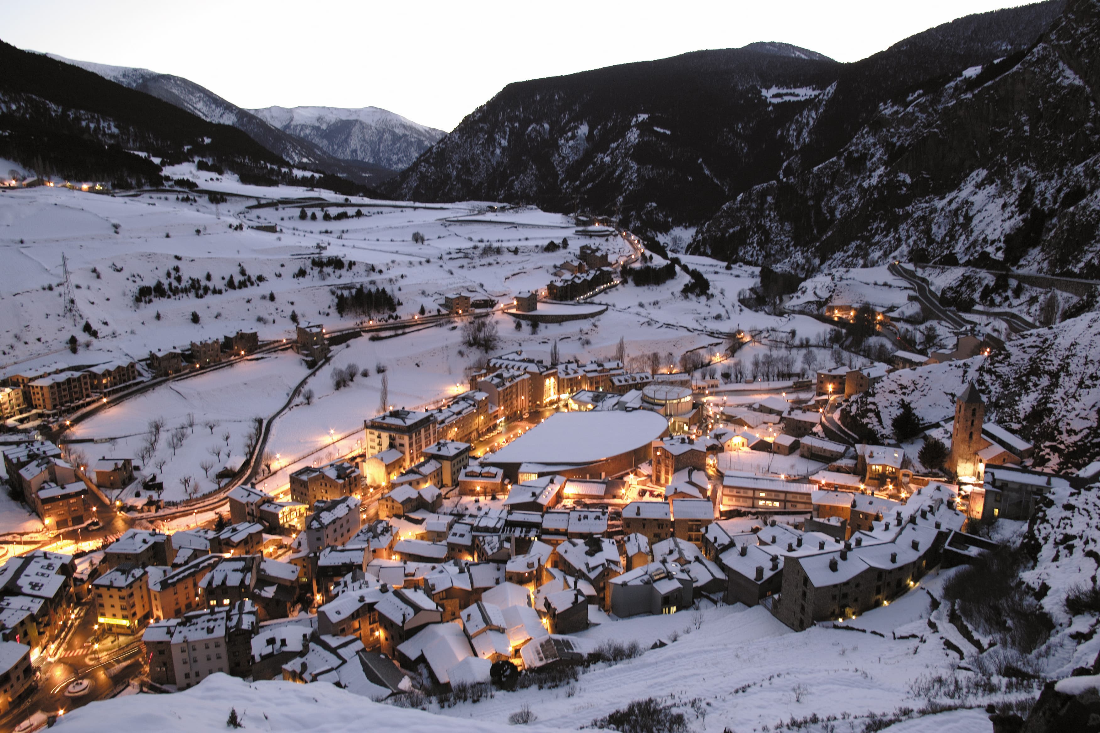 Canillo village at dusk, with the Palau de Gel at its centre