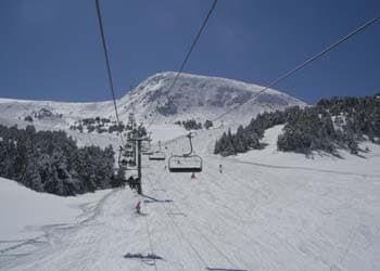 Ski lift in the mountains with lots of snow
