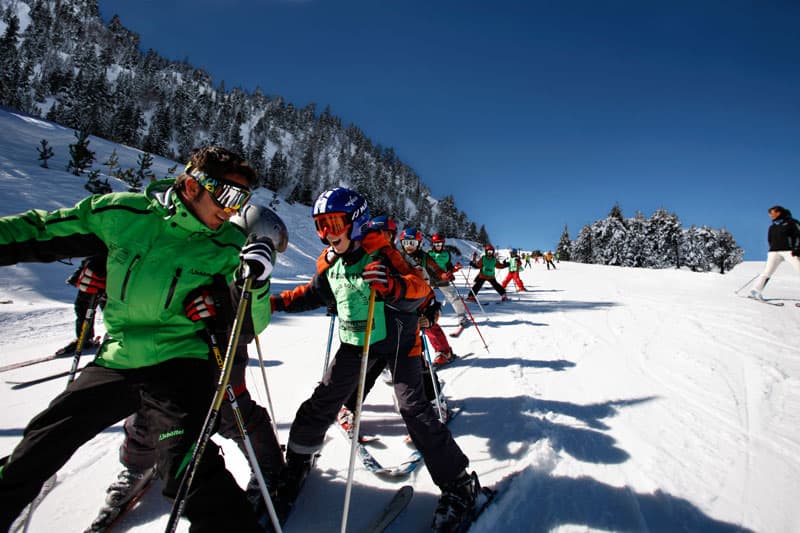 Vallnord ski instructor with a childrens ski school group