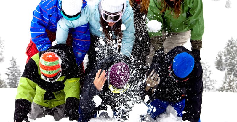 Group playing in snow