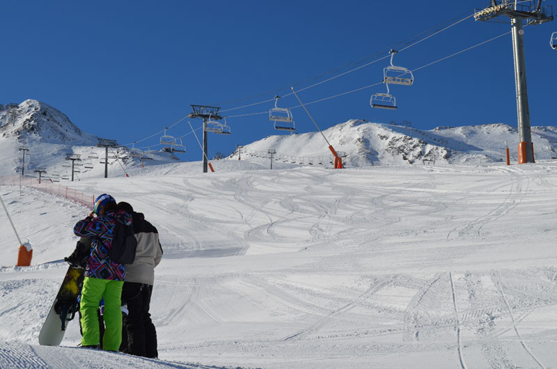 Blue sky and white snowy slopes in Pas de la Casa, Andorra