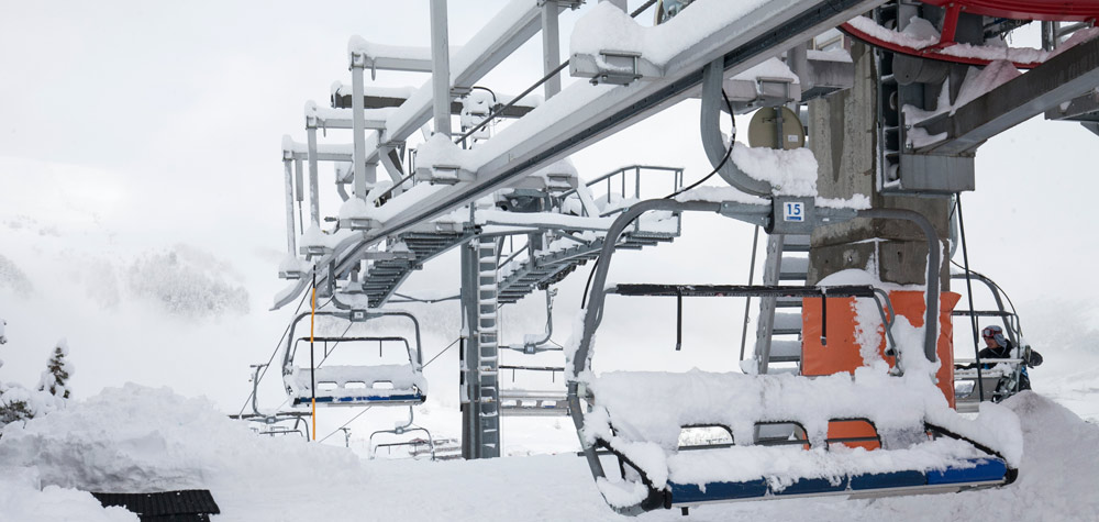 Chairlift covered in snow