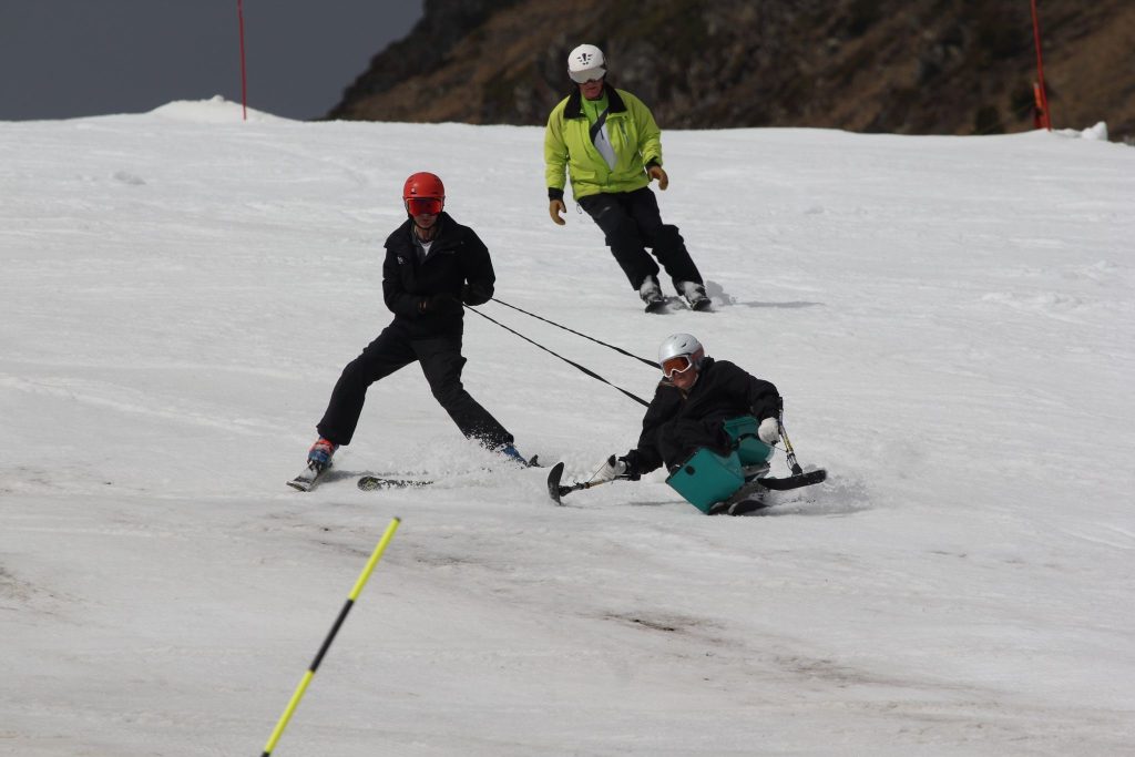 Anna skiing in Arinsal, with the help of Disability Snowsport UK.